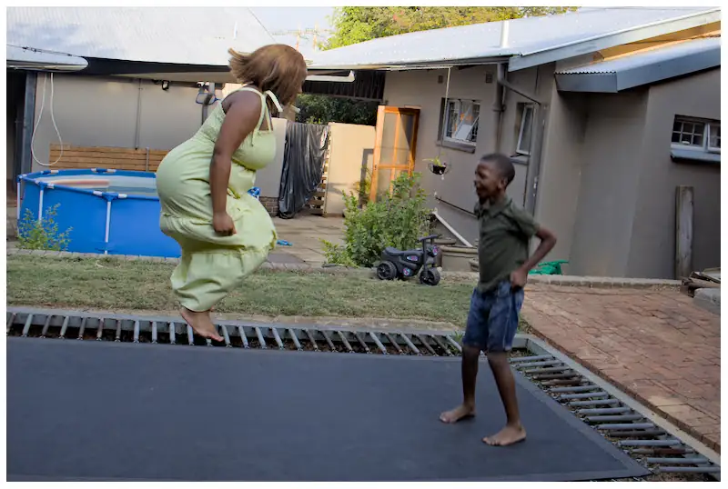 woman and child on trampoline