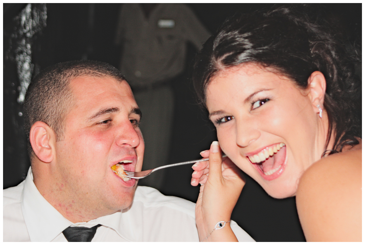 Bride and Groom eating cake